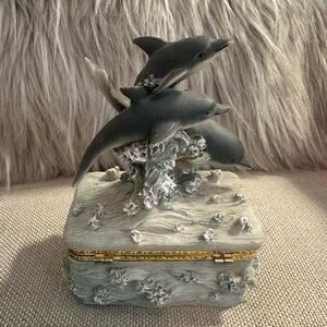 Dolphin trinket or jewelry box with gold bow clasp